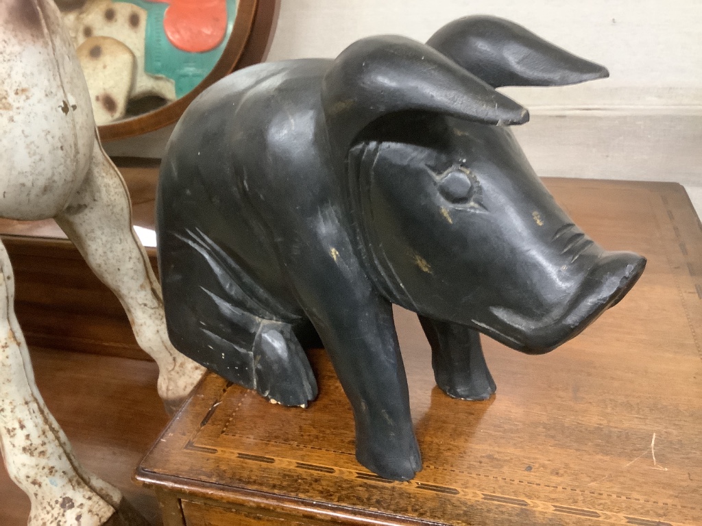 A painted carved wood pig, length 42cm, together with tin plate horse